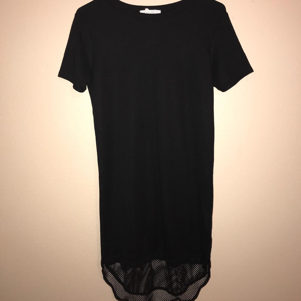 Black mini with net high-low detail.